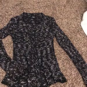 Black brown and white sweater. Brown buttons.